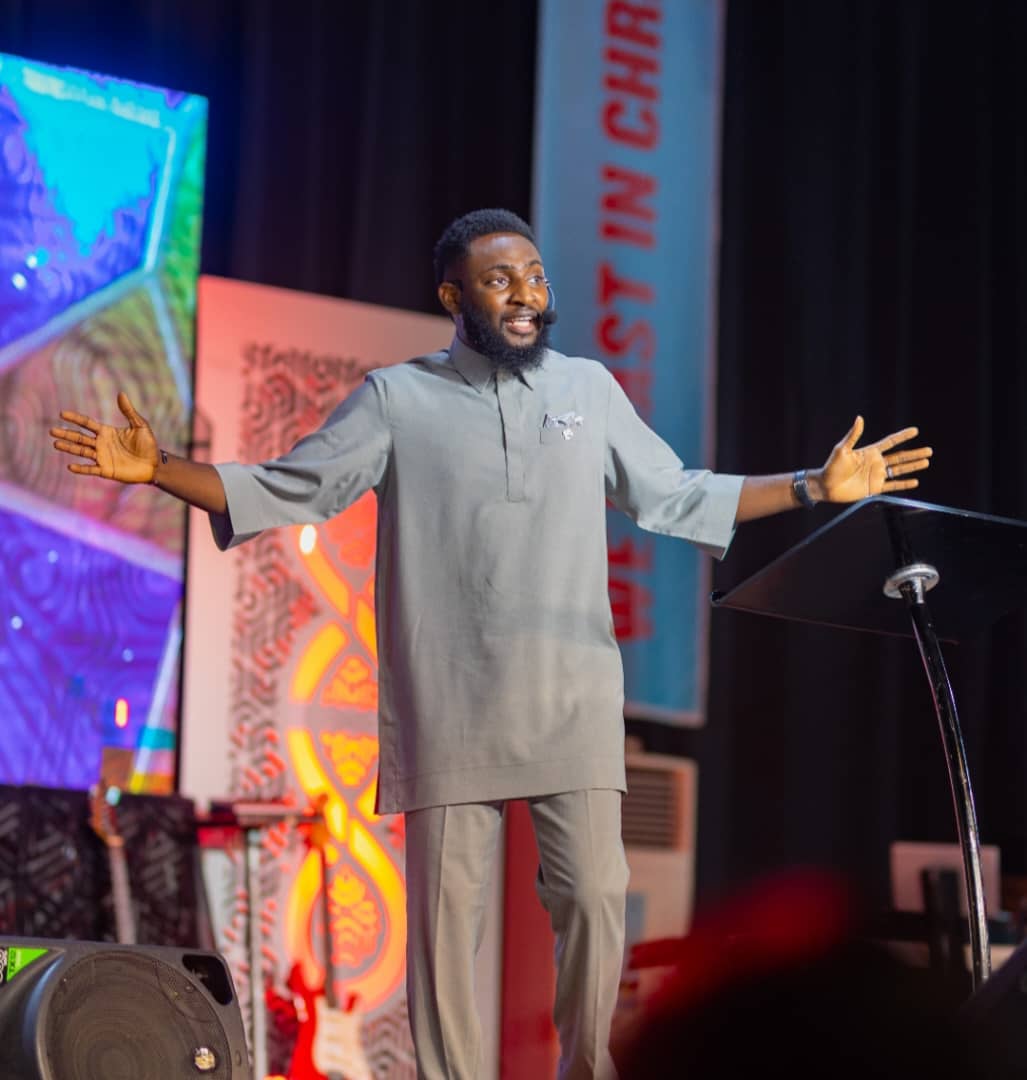 Pastor welcoming the congregation with open arms