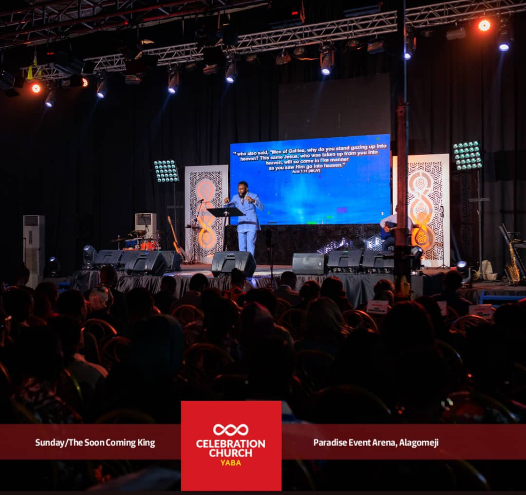 Preaching on stage at Paradise Event Arena, Alagomeji