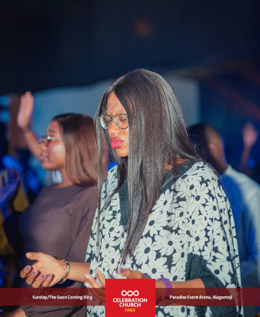 A member in prayer during service